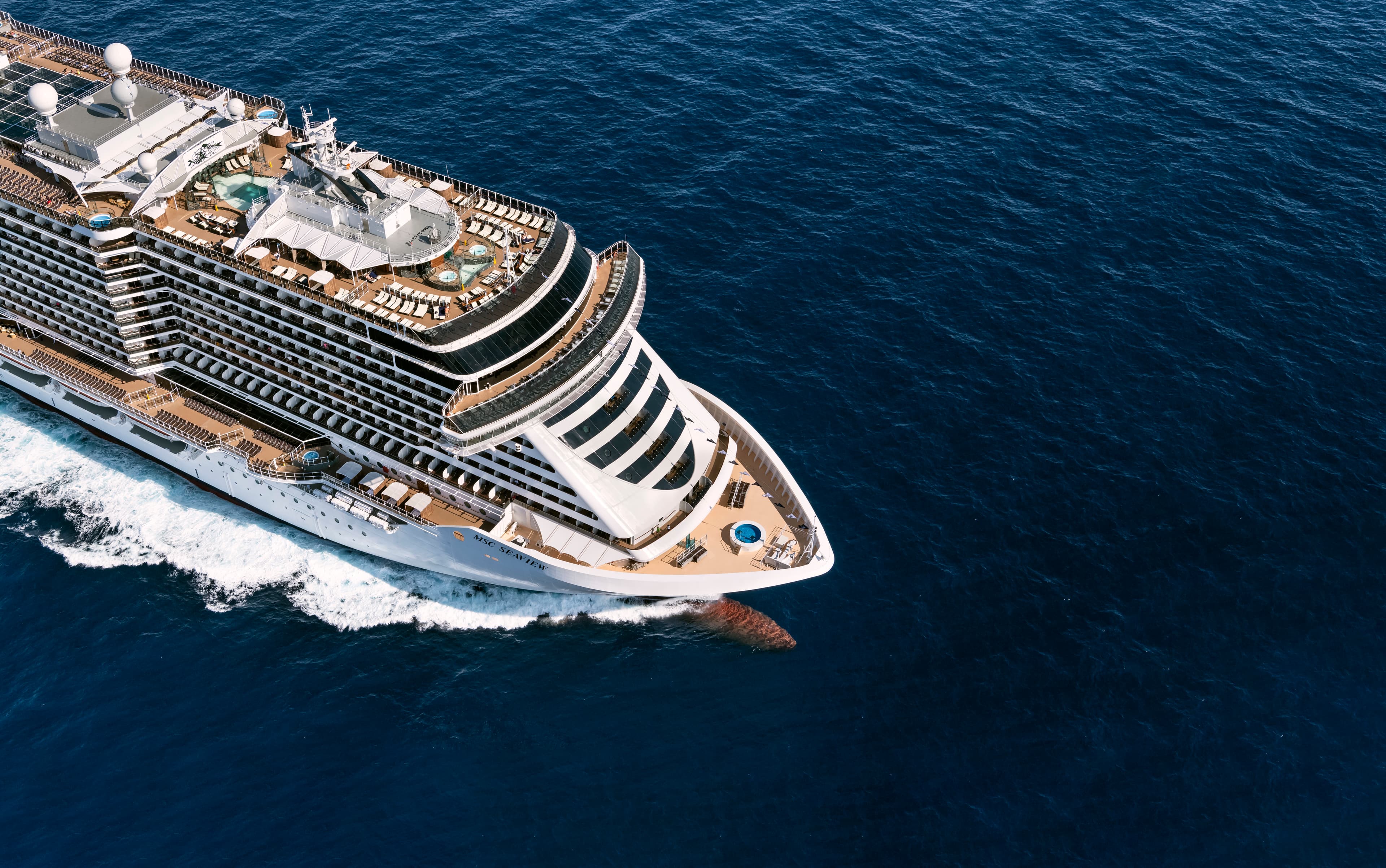 MSC Seaview port-side aerial underway under bright sun